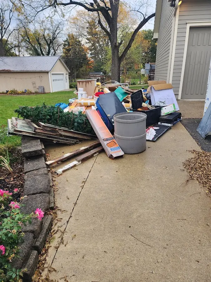 Dumpster being loaded with debris for Residential Dumpster Rental in Mattawan